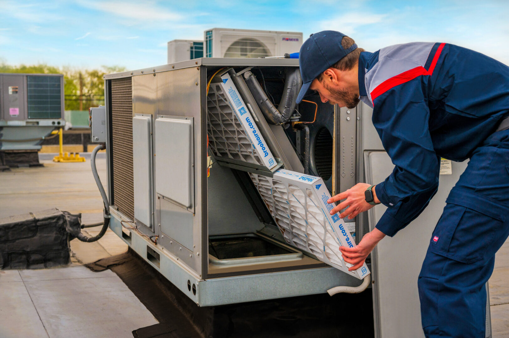 HVAC technician changing air filters