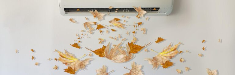 Autumn leaves blowing out of an airconditioner unit